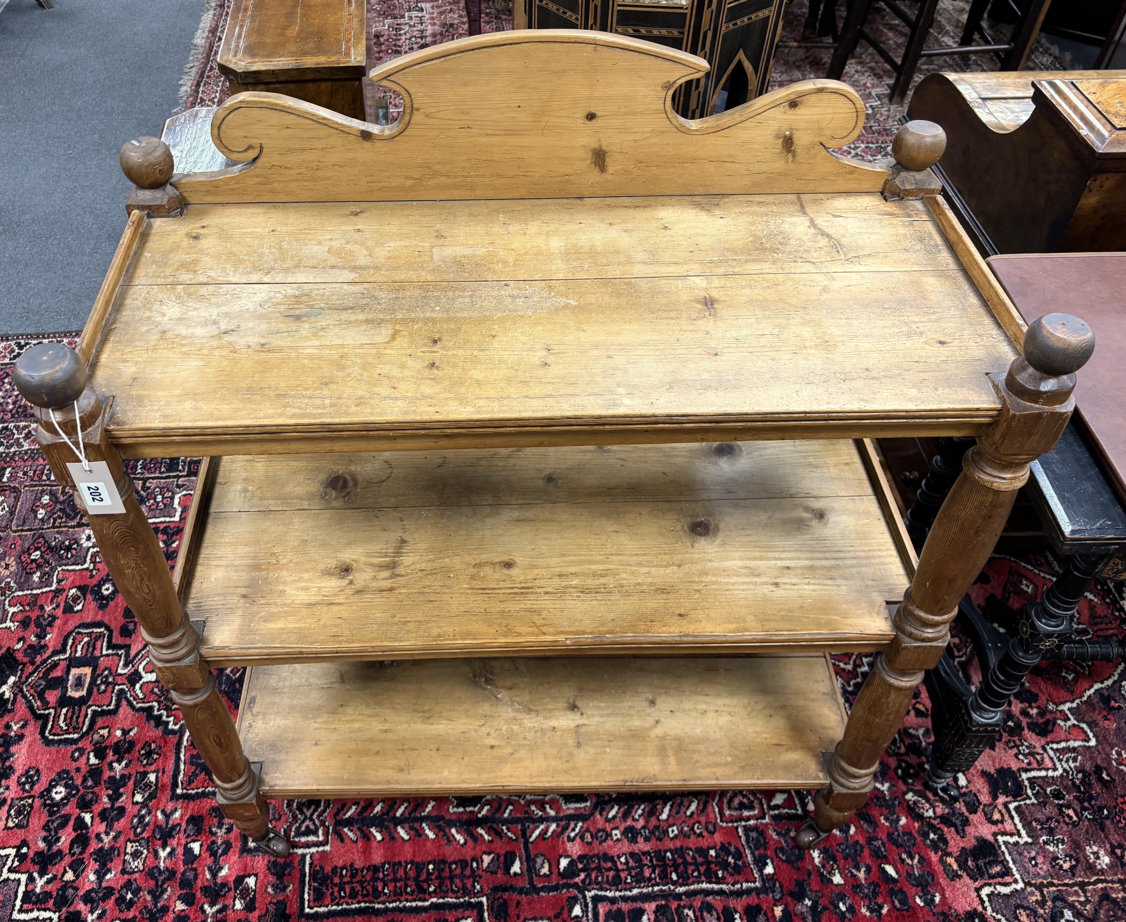 A Victorian pine three tier buffet, width 92cm, depth 43cm, height 110cm